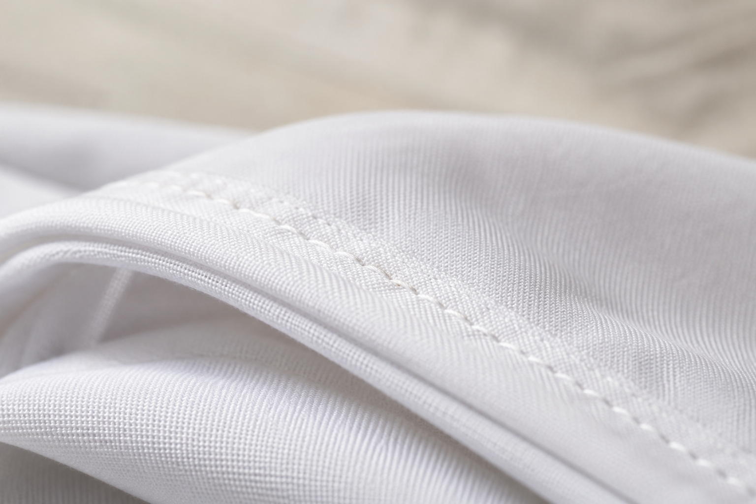 Close-up of the washable Cover Me Sheets fabric and reinforced stitching